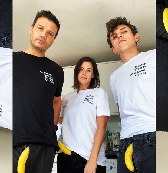 The genius minds who invented Branded + Moniker t-shirts stand seriously with bananas coming out of their trousers. Martyn's wearing a Joan t-shirt with the names Crawford, Collins, River and Of Arc. Buzz is wearing a Gloria t-shirt with Gaynor, Steinem, Estefan and Hunniford and Carl's wearing a Shirley t-shirt with Bassey, Temple, McClaine and Carter.